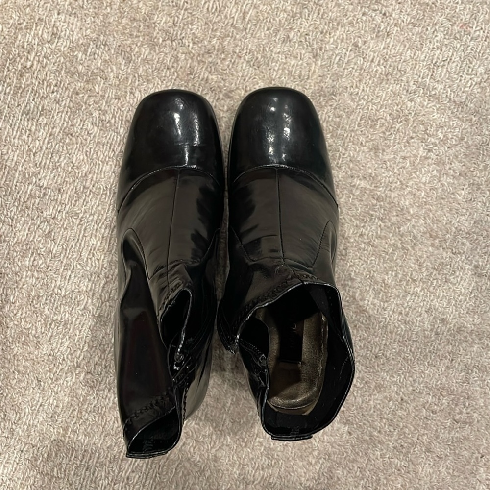 Women’s size 5 black patent leather ankle boots.  Side zipper.  Never worn.